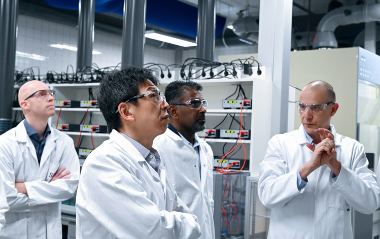People Inspecting Labs in White Coat